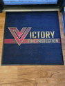 Custom Made Spectrum Logo Rug Victory Fire Protection of Wheatridge Colorado