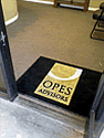 Custom Made Spectrum Logo Rug Opes Advisors of Modesto California