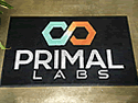 Custom Made Spectrum Logo Rug Primal Labs of Allen Texas