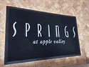 Custom Made Spectrum Logo Rug Springs at Apple Valley Apartments of Spring Valley Minnesota