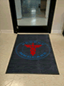 Custom Made Spectrum Logo Rug Urgent Medicare of Huntsville Alabama